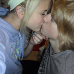 Blonde teen kissing her boyfriend